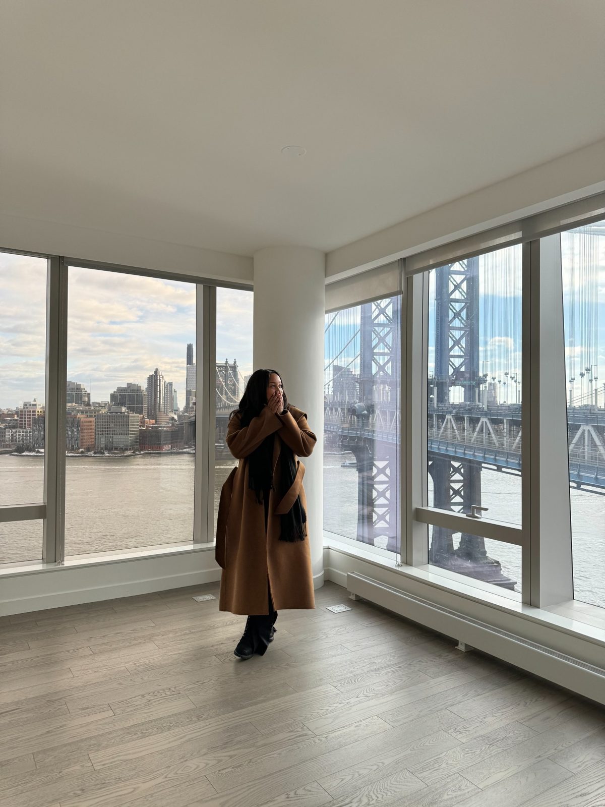 Alexis in a New York apartment with bridge view